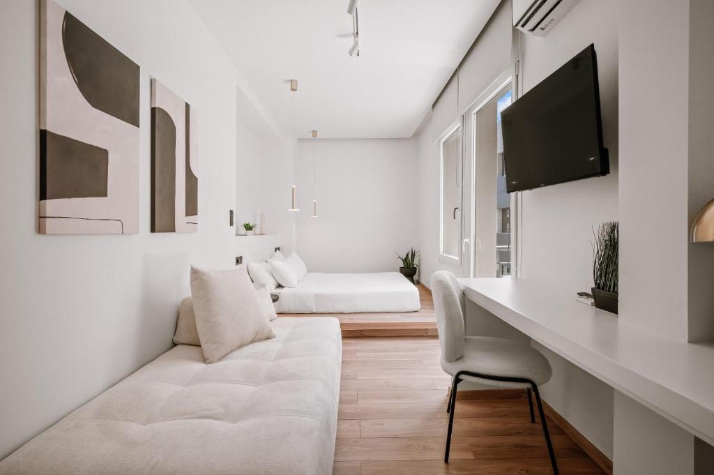 TV a/nebo společenská místnost v ubytování Plānis Str Urban Suites by Semavί