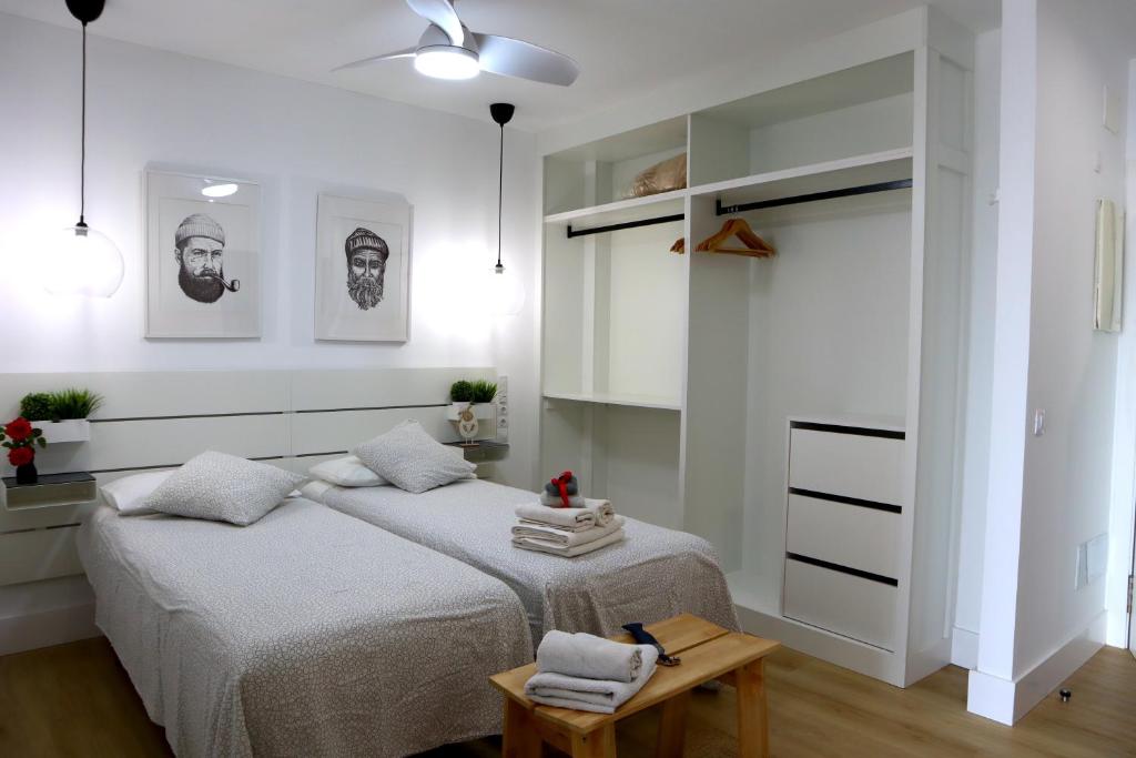 Posteľ alebo postele v izbe v ubytovaní Durmiendo sobre el mar, Vivienda La Baja Grande