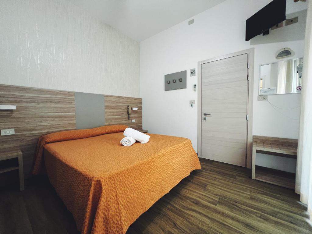 Postel nebo postele na pokoji v ubytování Hotel Ramona