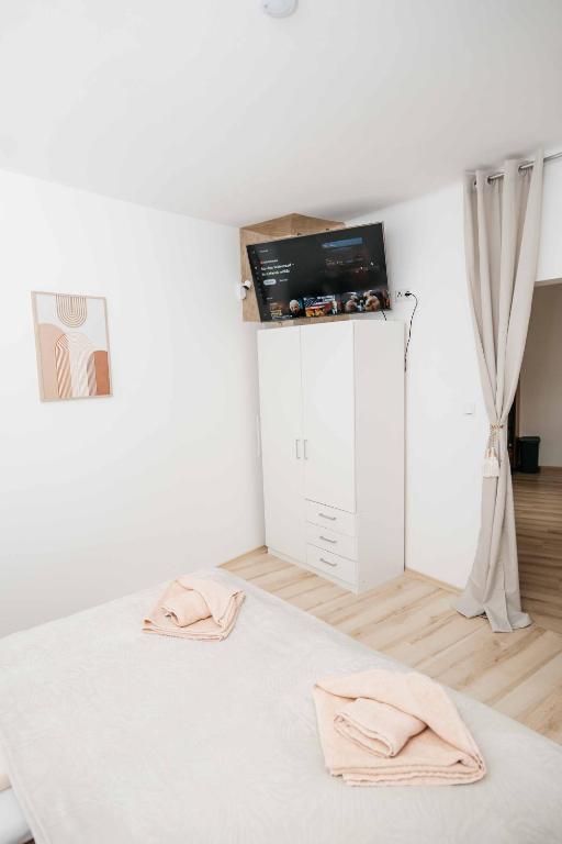 Postel nebo postele na pokoji v ubytování Kék-Ház Murau Centrum