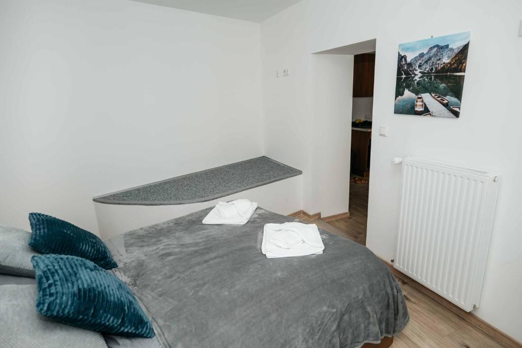 Postel nebo postele na pokoji v ubytování Kék-Ház Murau Centrum