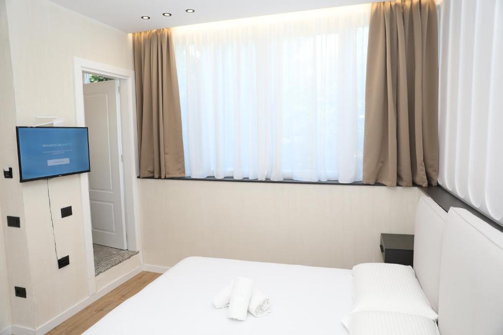 Letto o letti in una camera di Hotel Scutari
