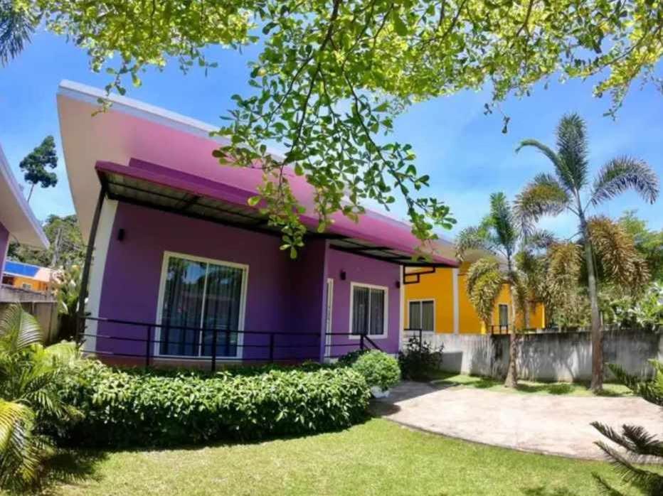 a colorful house with a yard at Little Purple House- AoNang in Ao Nang 