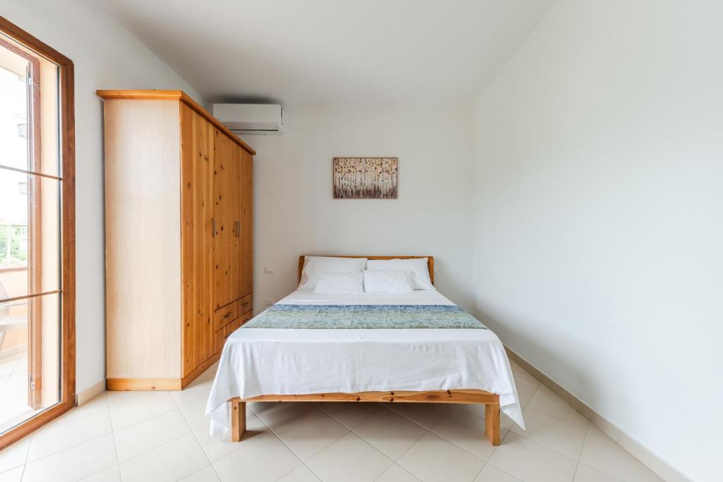 Postel nebo postele na pokoji v ubytování Titi's Villa