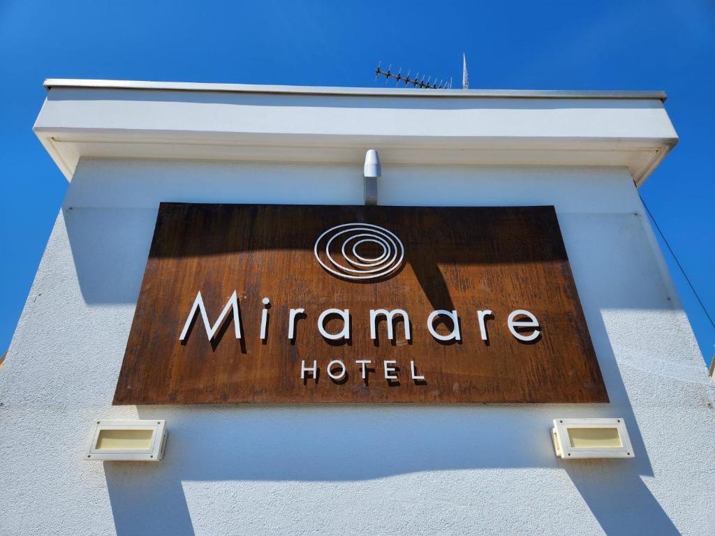a sign for a miramare hotel on a building at Hotel Miramare in Pineto