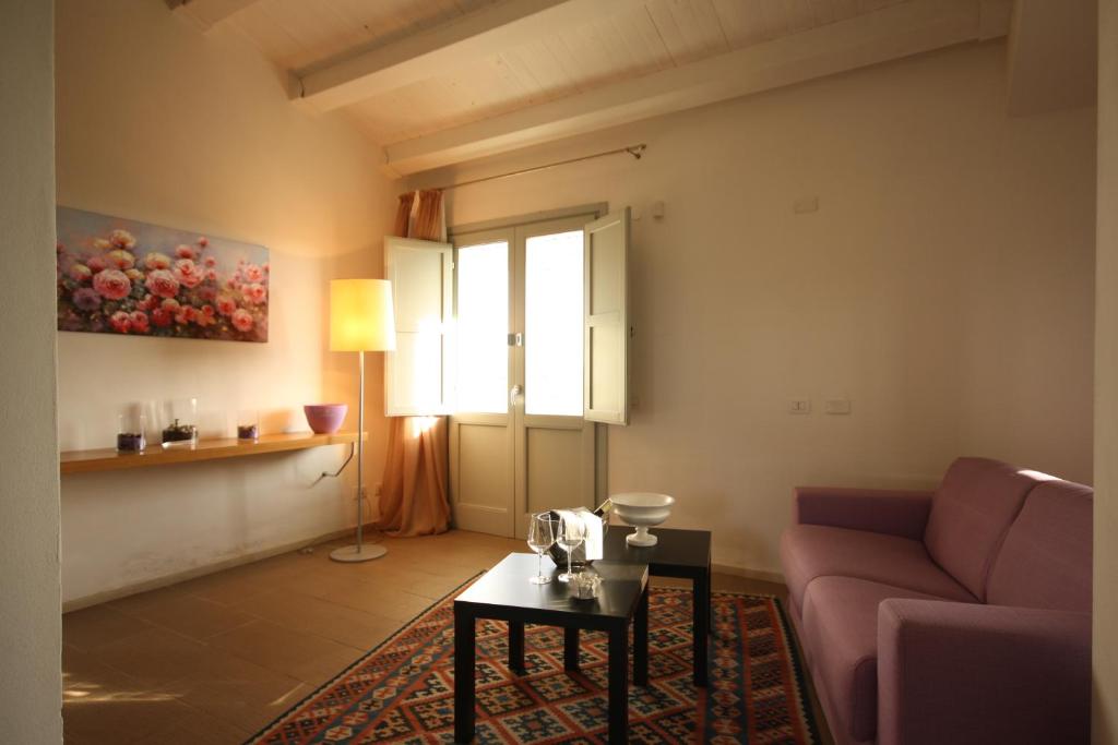 a living room with a couch and a table at Il Vigneto Resort in Menfi