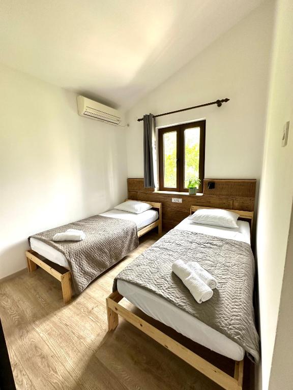 Postel nebo postele na pokoji v ubytování Guest house Kamelija