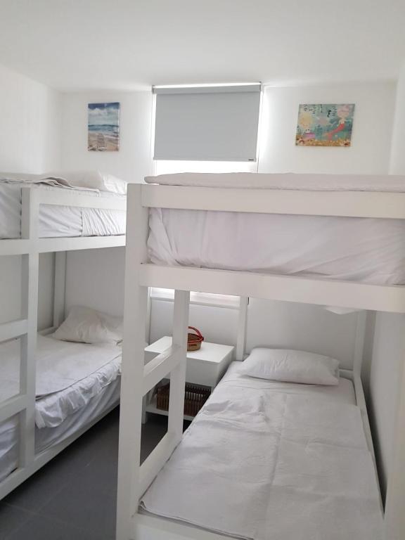 Postel nebo postele na pokoji v ubytování Llapa House