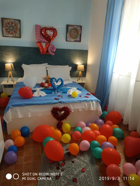 Postel nebo postele na pokoji v ubytování Rali Apartments