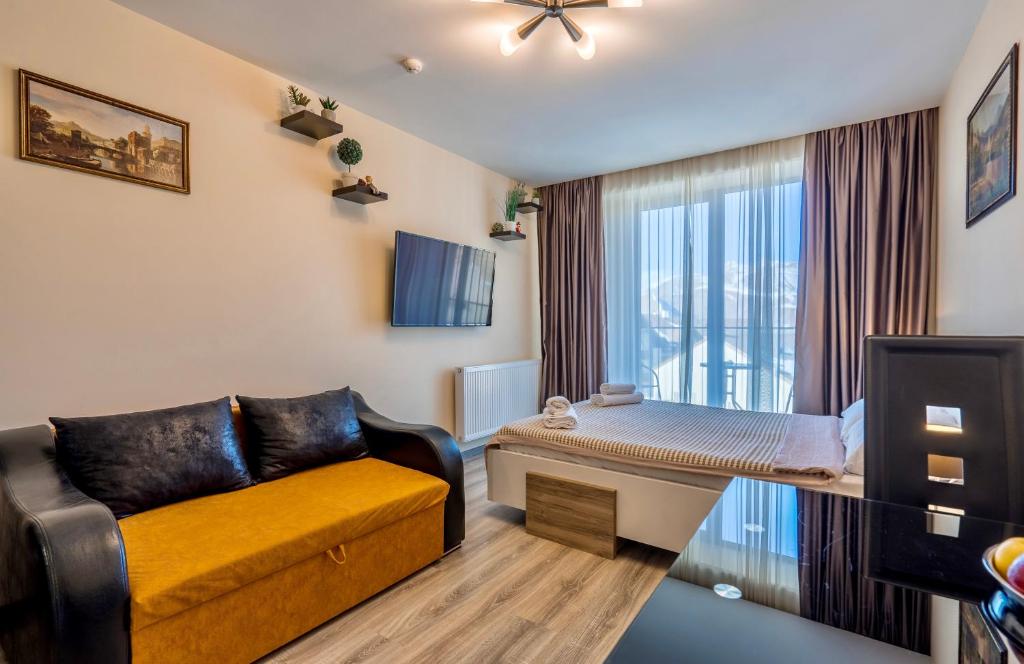 TV a/nebo společenská místnost v ubytování GVC New Gudauri Apartments