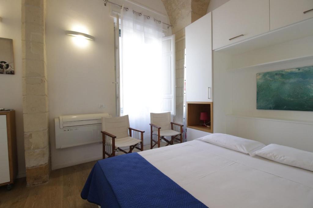 Posteľ alebo postele v izbe v ubytovaní GoodStay Al 14 (monolocale)