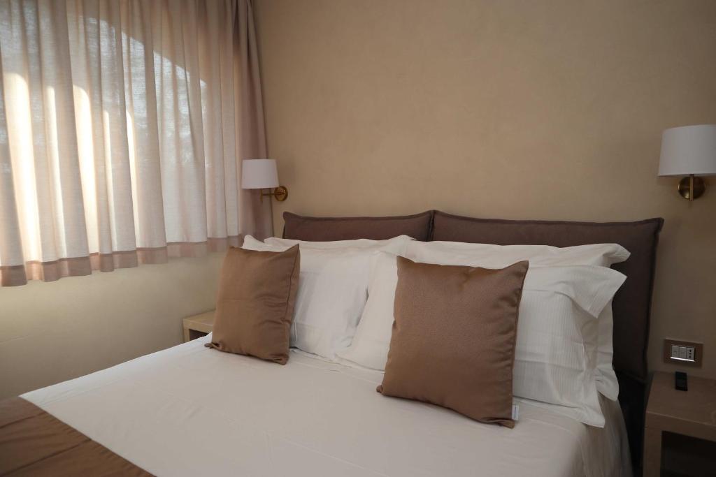 Postel nebo postele na pokoji v ubytování Quarto di Monte Suite & Spa