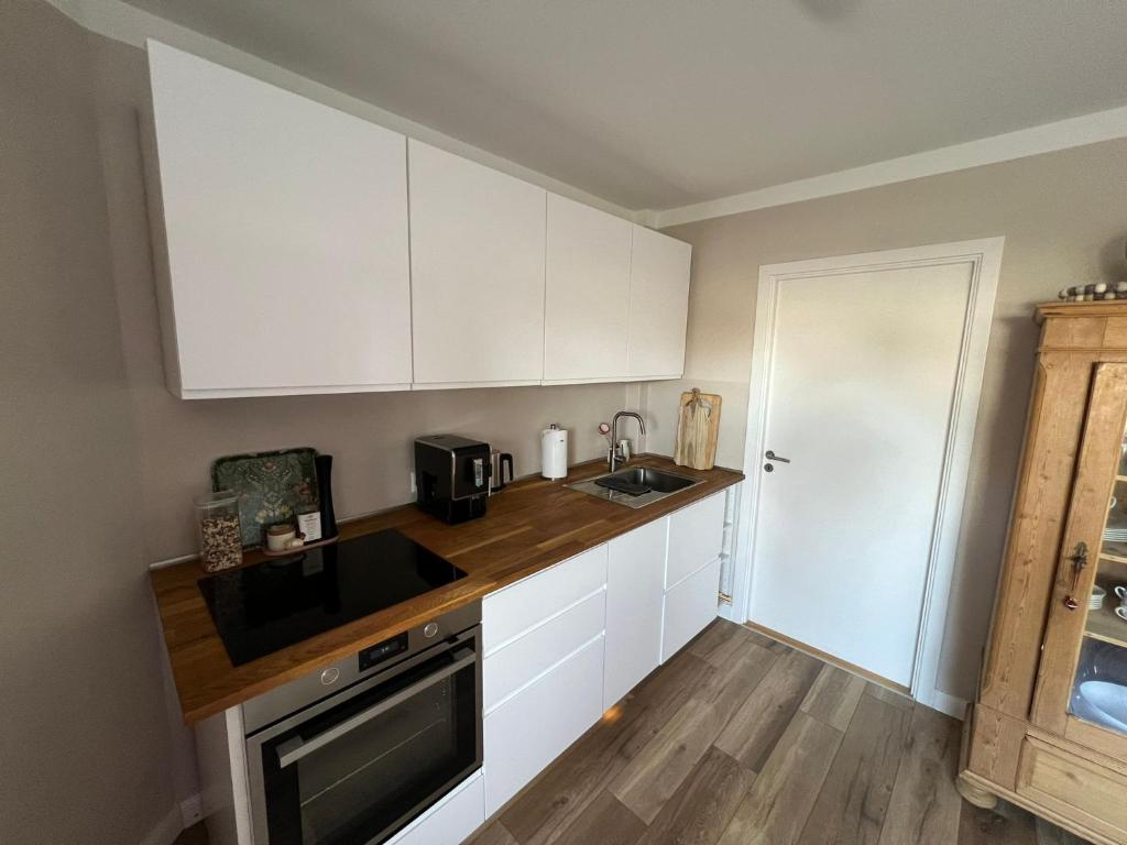 Kuchyň nebo kuchyňský kout v ubytování jygge- hyggelige Ferienwohnung