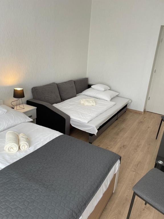 Postel nebo postele na pokoji v ubytování Széchenyi Apartman Esztergom