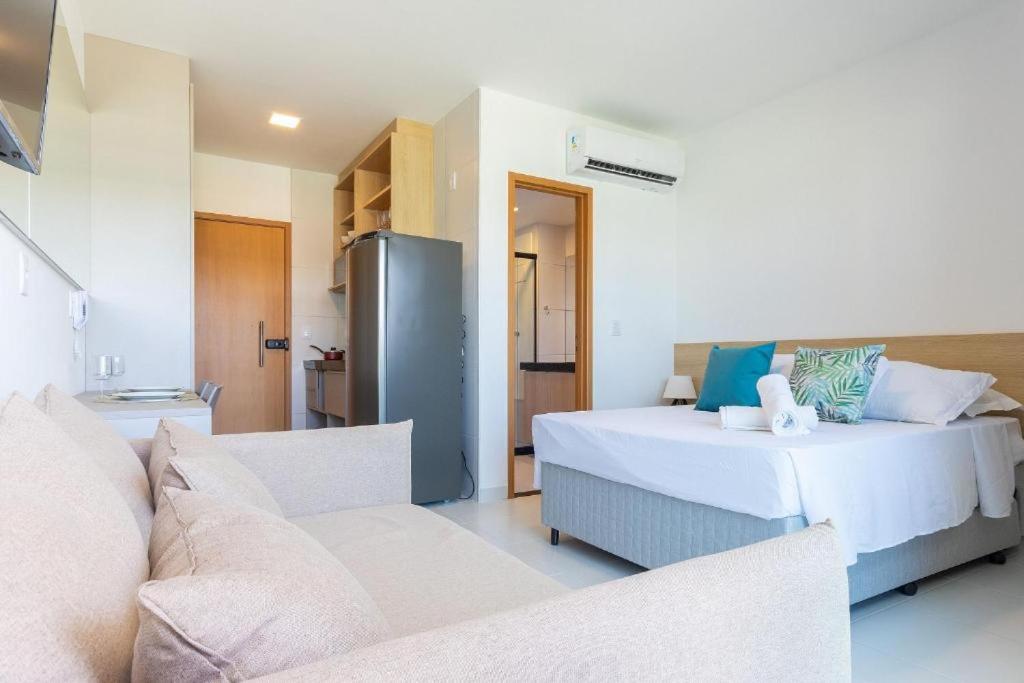 Ένα ή περισσότερα κρεβάτια σε δωμάτιο στο Makia Beach Encantador A-219 - Em Muro Alto