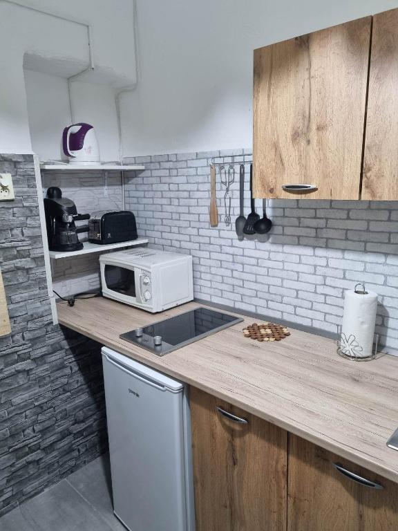 Kuchyňa alebo kuchynka v ubytovaní Napfény Apartman