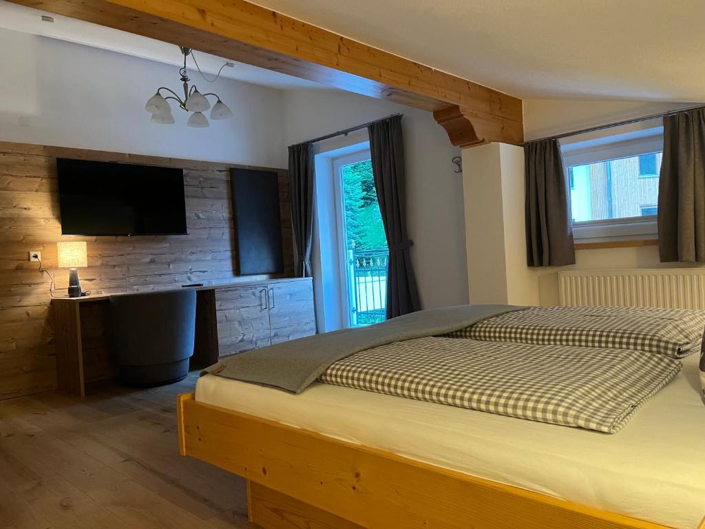 Postel nebo postele na pokoji v ubytování Sagebruenndle Appartements