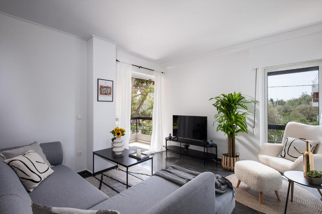 Χώρος καθιστικού στο Glyfada First Class Suite