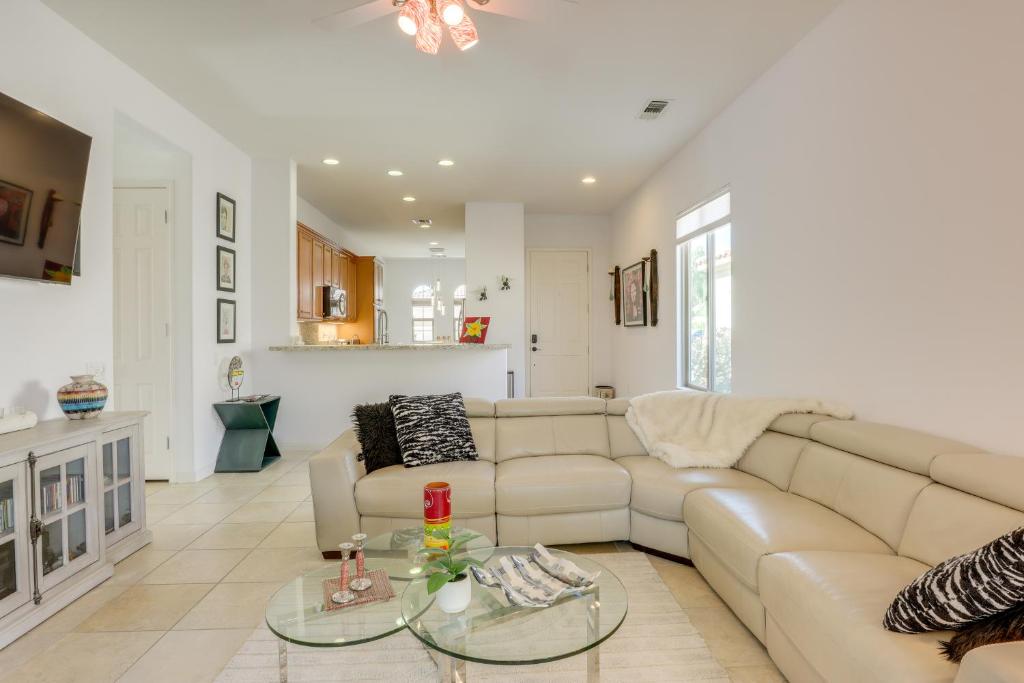 a living room with a couch and a table at Pet-Friendly Indio Home with Hot Tub 55 and Community in Indio