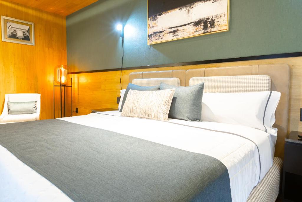 Postel nebo postele na pokoji v ubytování Hotel Noite Business Class