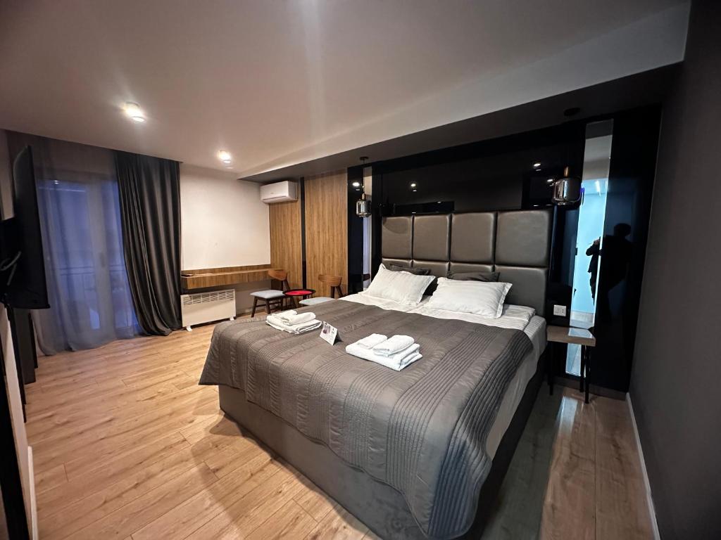 Postel nebo postele na pokoji v ubytování Garden Lounge Hotel