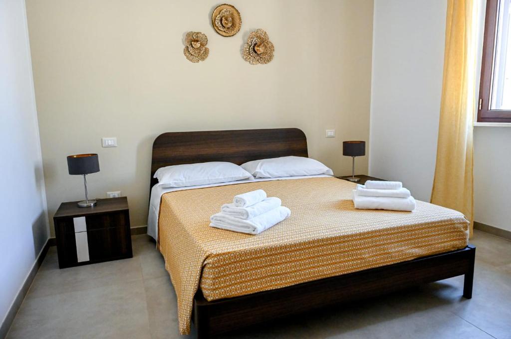 Postel nebo postele na pokoji v ubytování Sykelià - Guest House