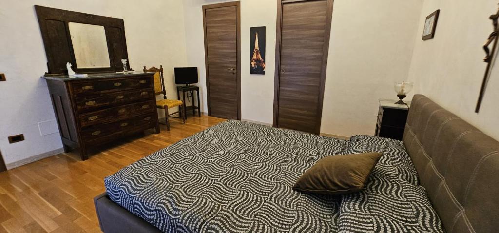 Postel nebo postele na pokoji v ubytování B&B Della Via Francigena