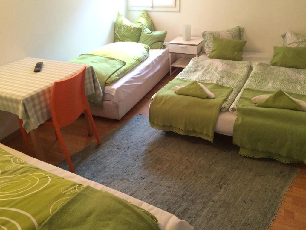 Postel nebo postele na pokoji v ubytování Cityhotel Junger Fuchs