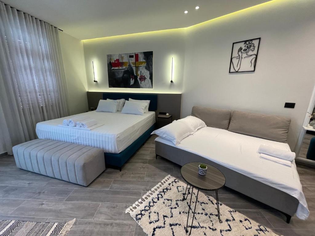 Postel nebo postele na pokoji v ubytování The cosy inn vlora