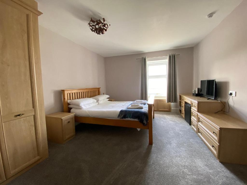 Postel nebo postele na pokoji v ubytování Bunessan Inn