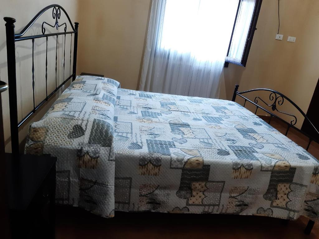 Postel nebo postele na pokoji v ubytování Il Dammuso di Gianni