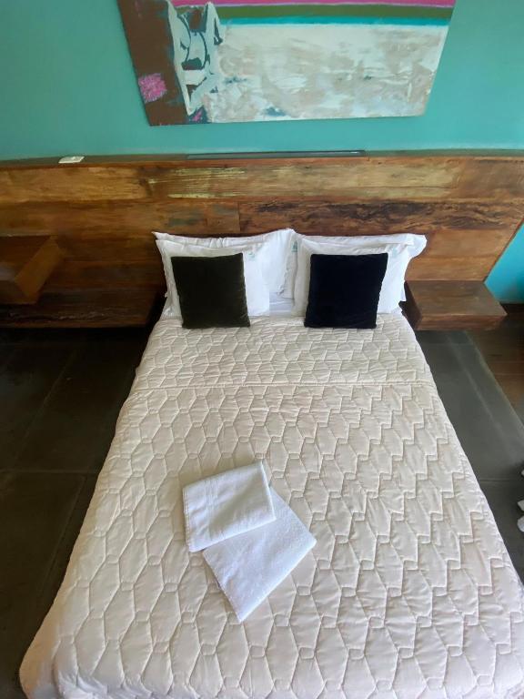 Cama ou camas em um quarto em Pousada Arágua