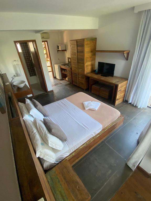 Cama ou camas em um quarto em Pousada Arágua
