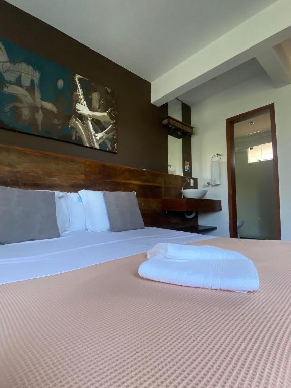 Cama ou camas em um quarto em Pousada Arágua