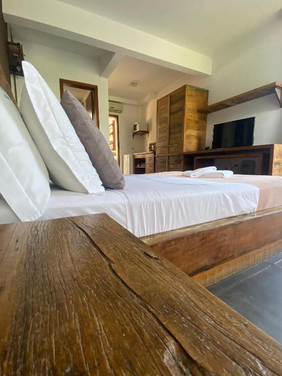 Cama ou camas em um quarto em Pousada Arágua