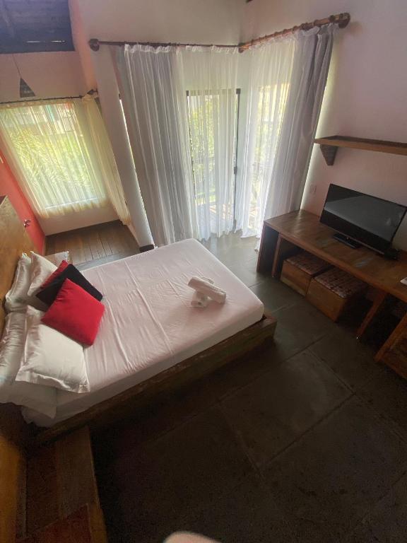 Cama ou camas em um quarto em Pousada Arágua