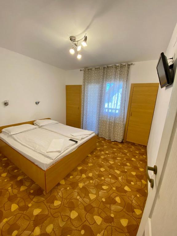 Postel nebo postele na pokoji v ubytování Vila Onix