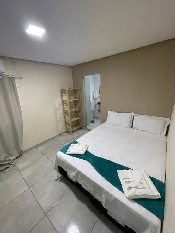 Cama ou camas em um quarto em Pousada Vista da Serra - Suzart