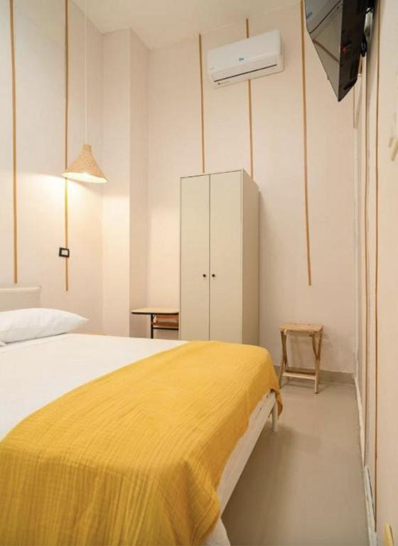 Postel nebo postele na pokoji v ubytování Hostal Mamà Mambò - Zona Colonial