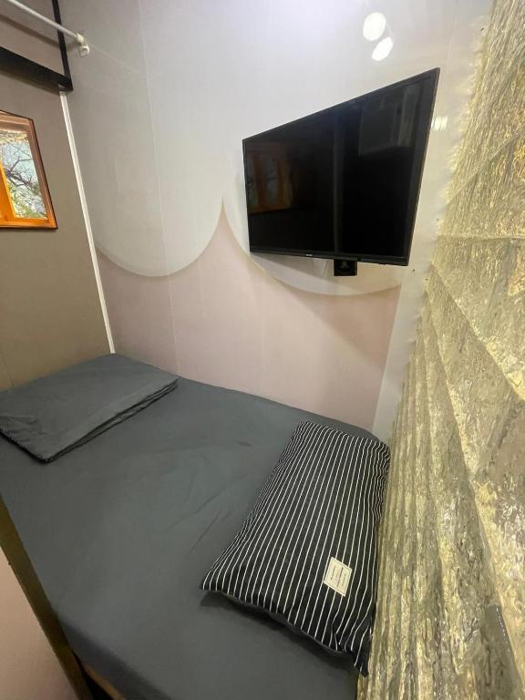 TV a/nebo společenská místnost v ubytování 榆迪賓館 YUTIK Guesthouse