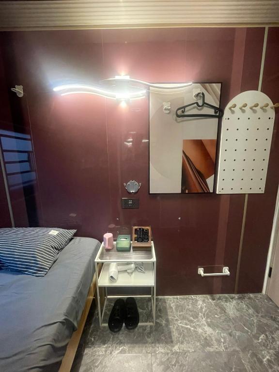 Postel nebo postele na pokoji v ubytování 榆迪賓館 YUTIK Guesthouse
