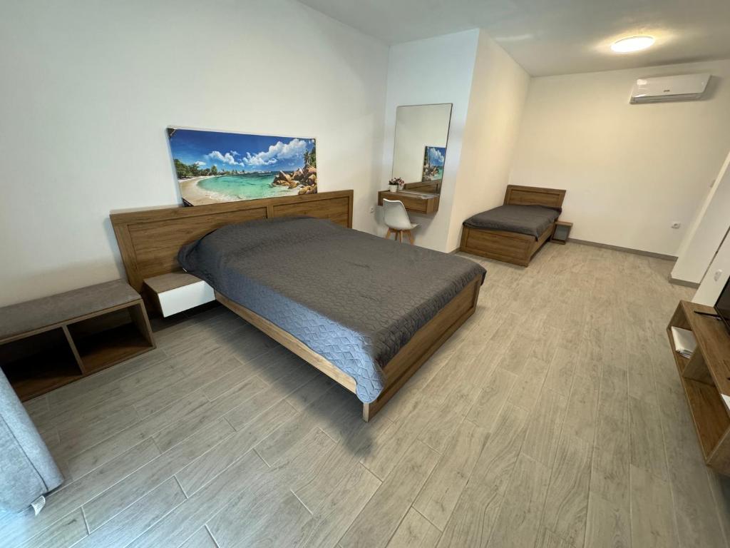 Postel nebo postele na pokoji v ubytování Adla Apartmani
