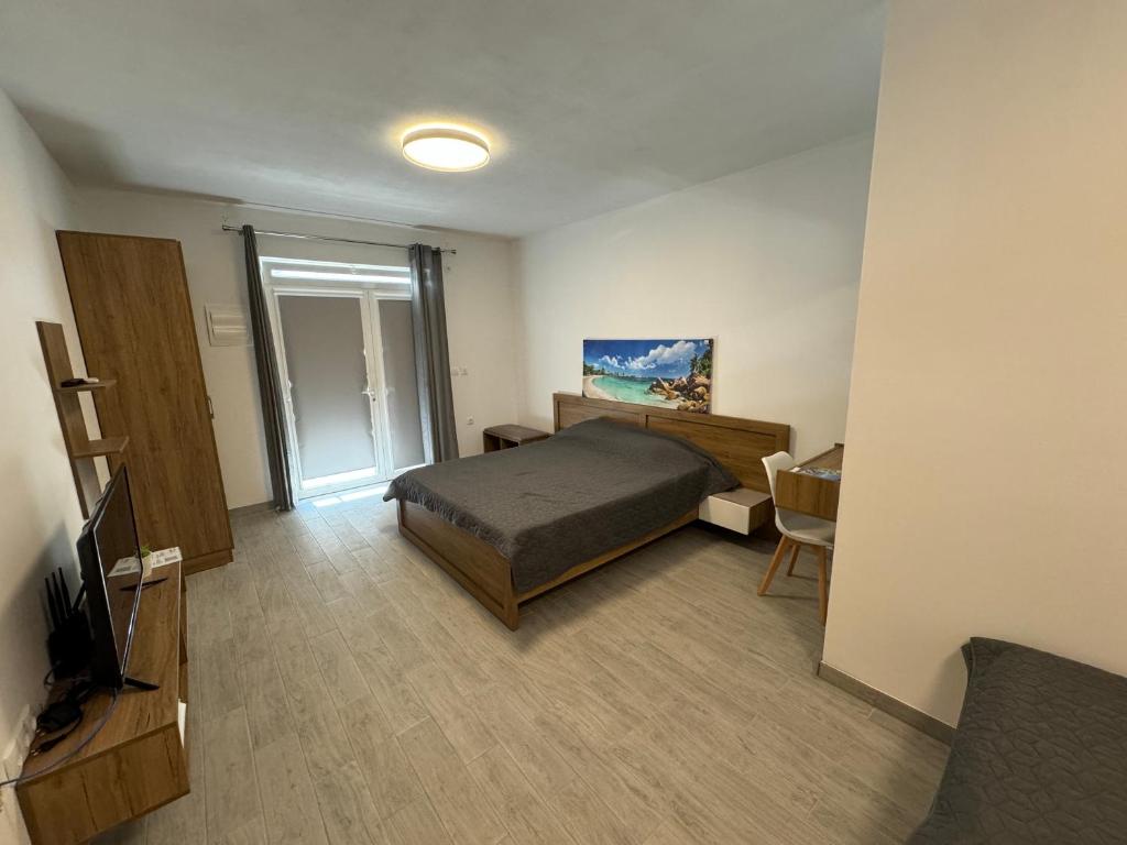 TV a/nebo společenská místnost v ubytování Adla Apartmani