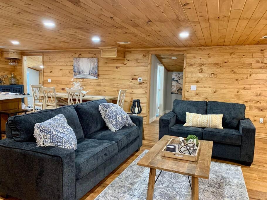 a living room with a couch and a table at Driftwood House in Mead