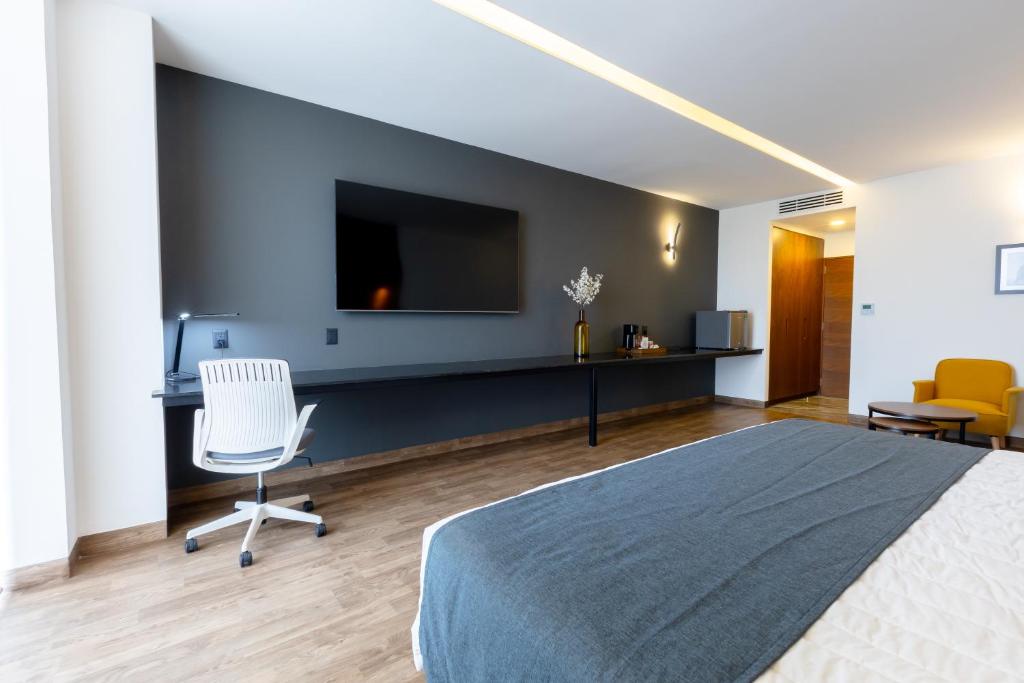 TV a/nebo společenská místnost v ubytování Hotel Noite Business Class