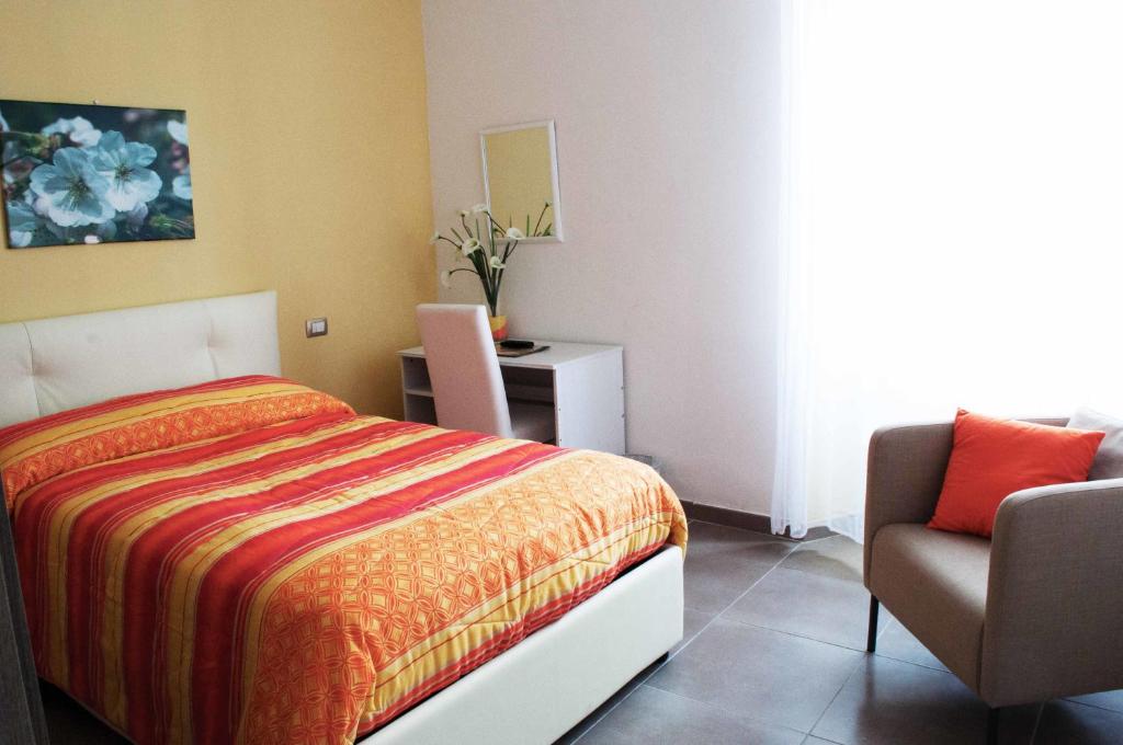 A bed or beds in a room at Il Giardinetto Guest House