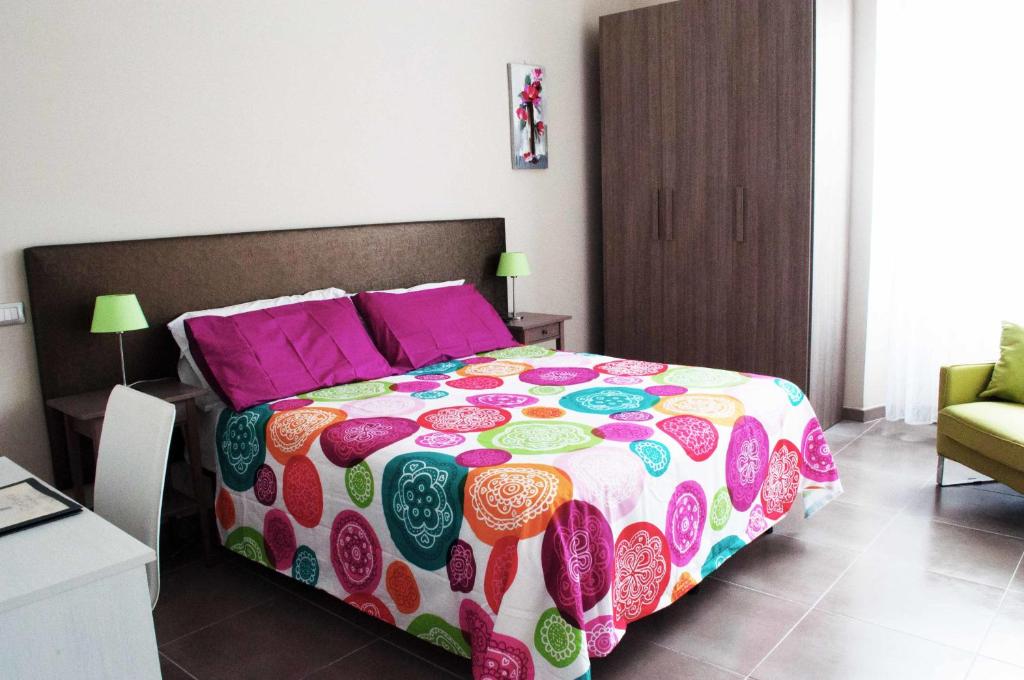 A bed or beds in a room at Il Giardinetto Guest House