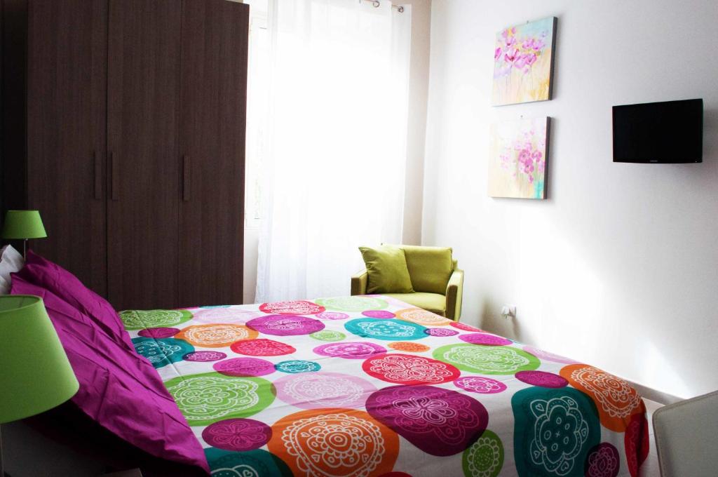 A bed or beds in a room at Il Giardinetto Guest House
