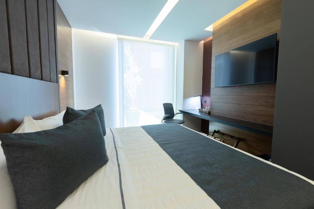 Postel nebo postele na pokoji v ubytování Hotel Noite Business Class
