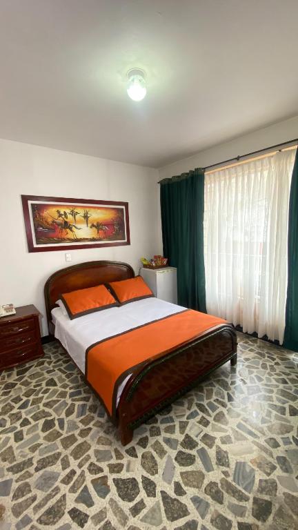 Postel nebo postele na pokoji v ubytování Hotel Tequendama